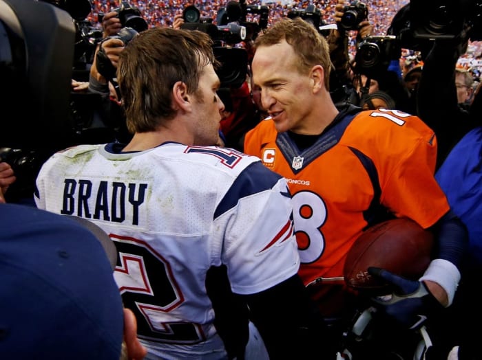 New England Patriots quarterback Tom Brady (12) and Denver Broncos quarterback Peyton Manning (18) shake hands after the game in the AFC Championship football game at Sports Authority Field at Mile High. Mandatory Credit: Kevin Jairaj-USA TODAY Sports
